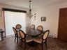 Dining space featuring a baseboard radiator and stone finish flooring