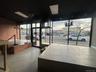Common area featuring brick wall and expansive windows