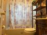 Full bath with shower / tub combo and vanity