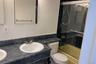 Full bathroom with vanity and bath / shower combo with glass door