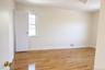 Spare room with light wood-style floors and baseboards