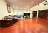 Living room featuring stairs, light wood finished floors, and recessed lighting