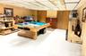 Game room featuring a paneled ceiling, billiards table, and wooden walls