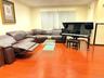 Living area featuring light wood-type flooring and ornamental molding