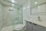 Bathroom with a stall shower and vanity