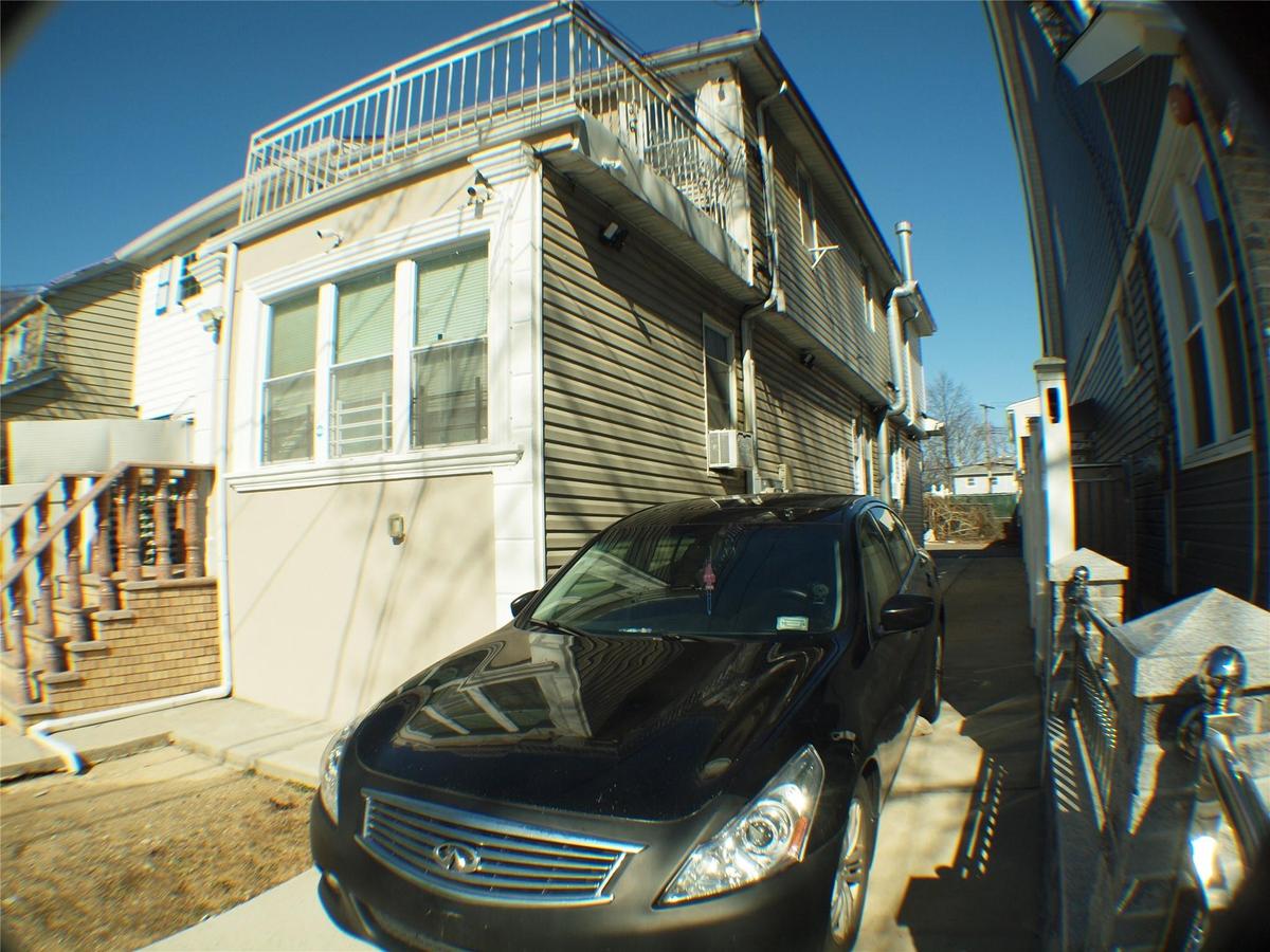 View of home's exterior featuring a balcony