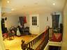 Stairs with recessed lighting, lofted ceiling, and wood finished floors
