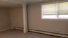 Unfurnished room featuring a baseboard radiator and ornamental molding