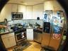 Kitchen featuring tasteful backsplash, visible vents, appliances with stainless steel finishes, light wood-style floors, and a sink