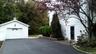 Detached garage featuring asphalt driveway
