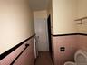 Bathroom featuring tile walls, tile patterned flooring, and wainscoting