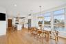Dining space with recessed lighting, light wood-type flooring, and a water view