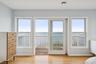 Unfurnished bedroom with a water view, access to exterior, and light wood-type flooring