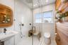 Full bath featuring a stall shower, recessed lighting, tile walls, and tile patterned floors