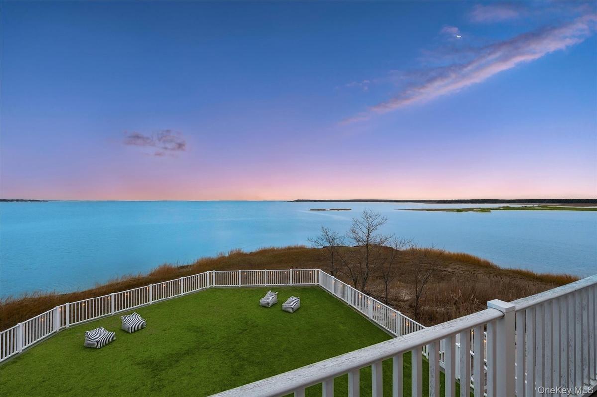 Water view with a fenced backyard