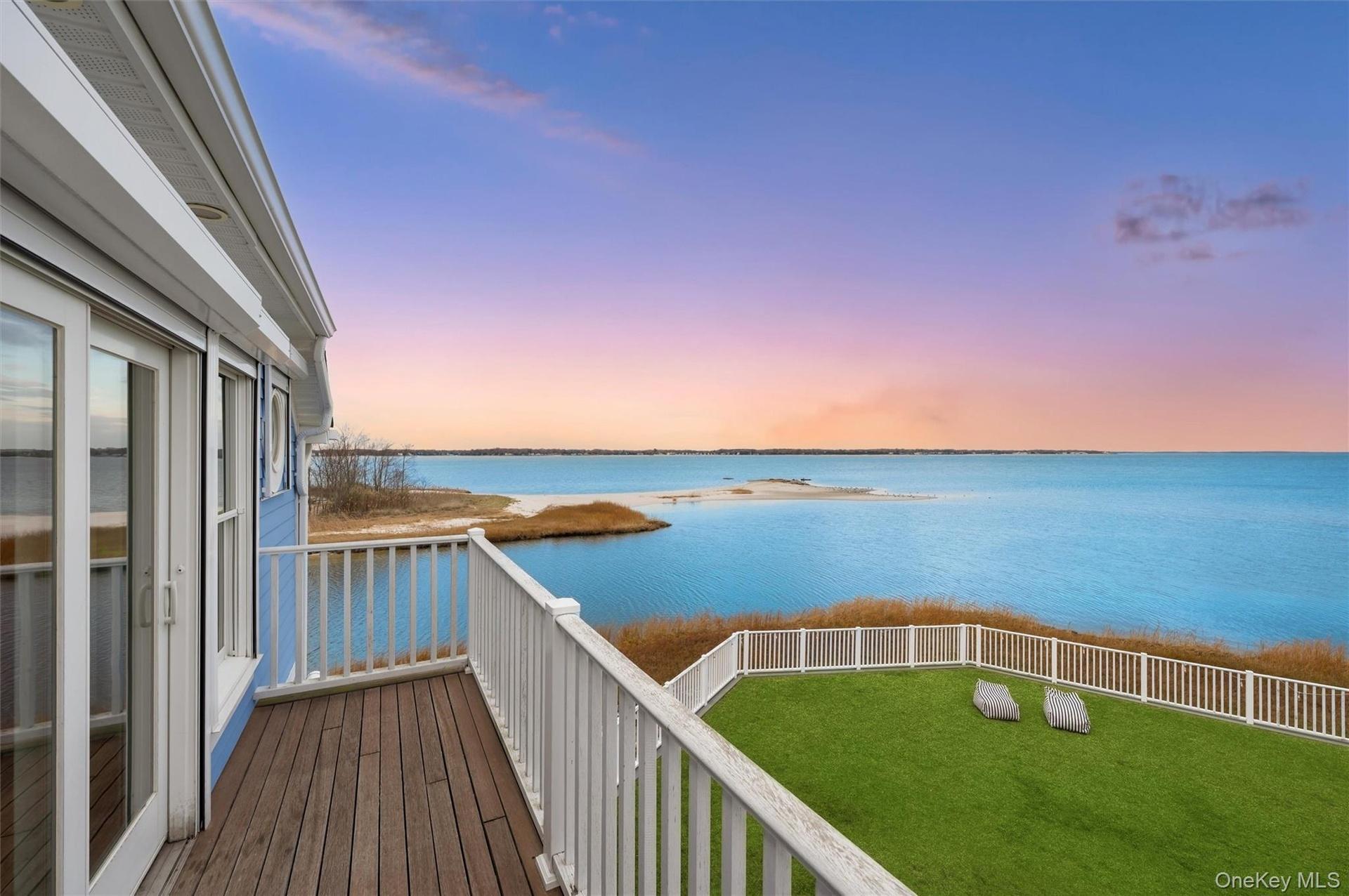 Balcony at dusk with a water view