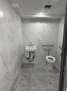 Bathroom featuring sink and toilet