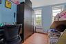Bedroom featuring radiator, light wood-style flooring, a closet, and baseboards