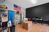 Home office featuring wood finished floors and rail lighting