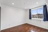 Spare room featuring dark wood-style floors, a wall unit AC, and recessed lighting
