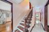 Staircase with baseboards and ornamental molding