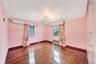 Empty room with hardwood / wood-style floors, a chandelier, radiator, and a wall mounted air conditioner