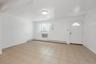 Foyer entrance featuring baseboards and a baseboard heating unit