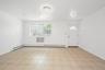 Foyer entrance with baseboards and baseboard heating
