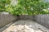 Fenced backyard with a patio