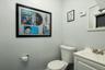 Half bathroom featuring toilet and vanity