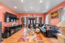 Living area with recessed lighting and light wood-style flooring