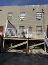 Rear view of property with a wooden deck