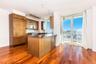 Kitchen with tasteful backsplash, sink, dark hardwood / wood-style floors, paneled refrigerator, and kitchen peninsula
