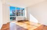 Unfurnished room with radiator and hardwood / wood-style flooring