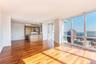 Unfurnished living room with hardwood / wood-style flooring and floor to ceiling windows