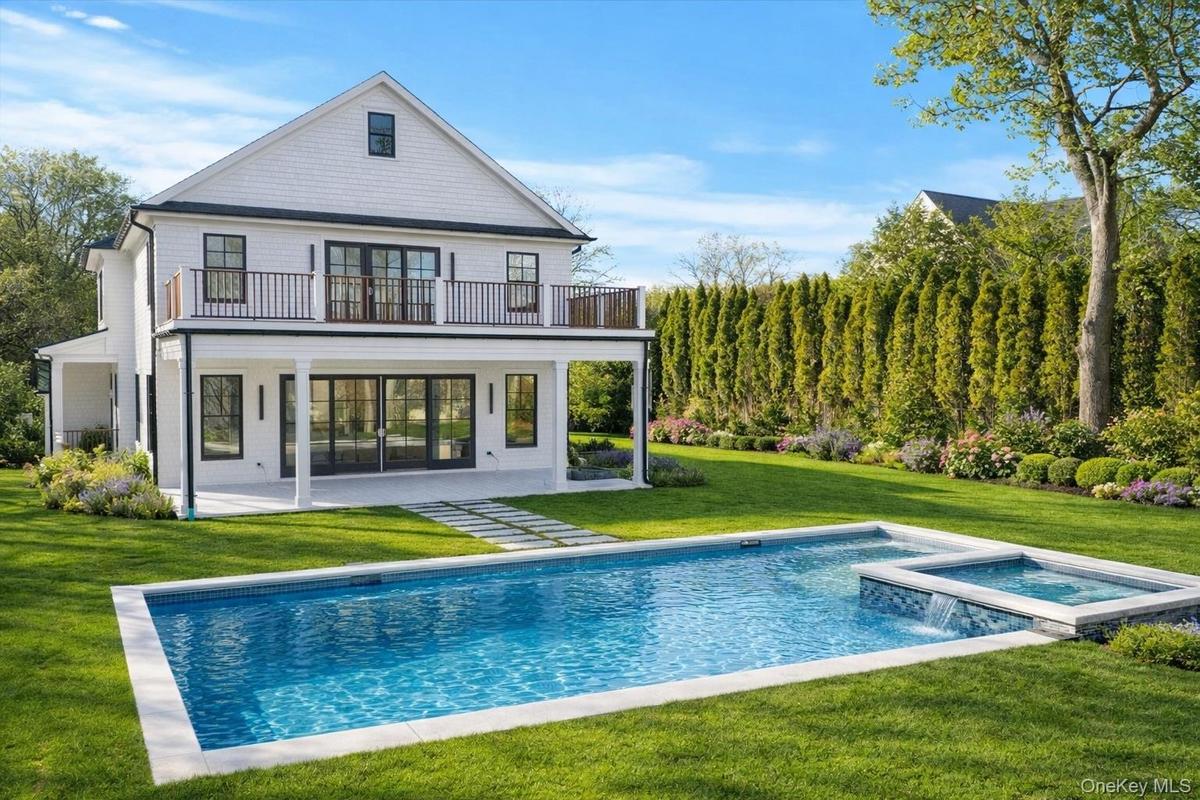 An exceptional waterfront retreat offering private dockage, direct inlet access, a heated 20x40 gunite saltwater pool with jacuzzi is surrounded by im