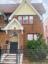 Entrance to property with brick siding