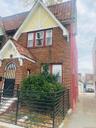 View of side of home with brick siding