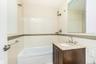 Bathroom featuring tile walls, vanity, bathtub / shower combination, and decorative backsplash