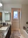 Primary windowed Bathroom with separate shower and jacuzzi tub