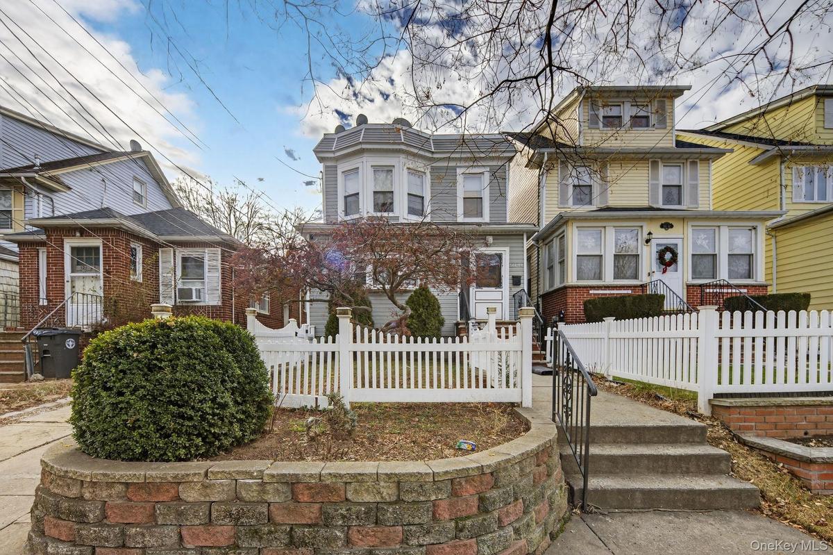 View of front of property with a fenced front yard