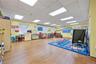 Game room with a paneled ceiling and wood finished floors