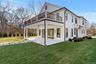 A covered porch extends the living space outdoors perfect for enjoying the water views and sunsets