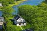 A striking waterfront estate set on 1.33 acres along coveted Mattituck Inlet,blending timeless architecture with refined modern luxury