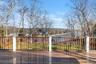 Expansive mahogany decking creates an ideal setting for outdoor relaxation overlooking the water