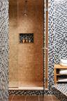 Bathroom with a stall shower and tile patterned floors