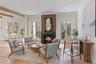 Anchored by a Heat & Glo propane fireplace, the living space is designed for both relaxed everyday living and elegant entertaining with plenty of natu