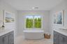 Spa inspired luxury with radiant heated floors, refined finishes and a calming design that reflects the home's coastal setting