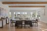 An elegant dining space perfectly positioned to capture water views, ideal for hosting gatherings large or intimate