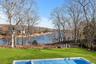 Gunite pool with expansive yard and water view
